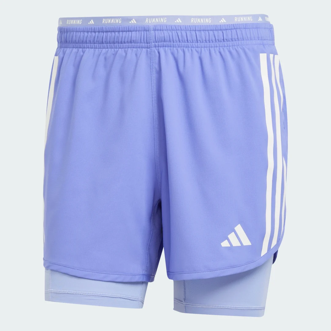 Detalle de Pantalón corto Own the Run 2-in-1 3 bandas de Adidas – azul