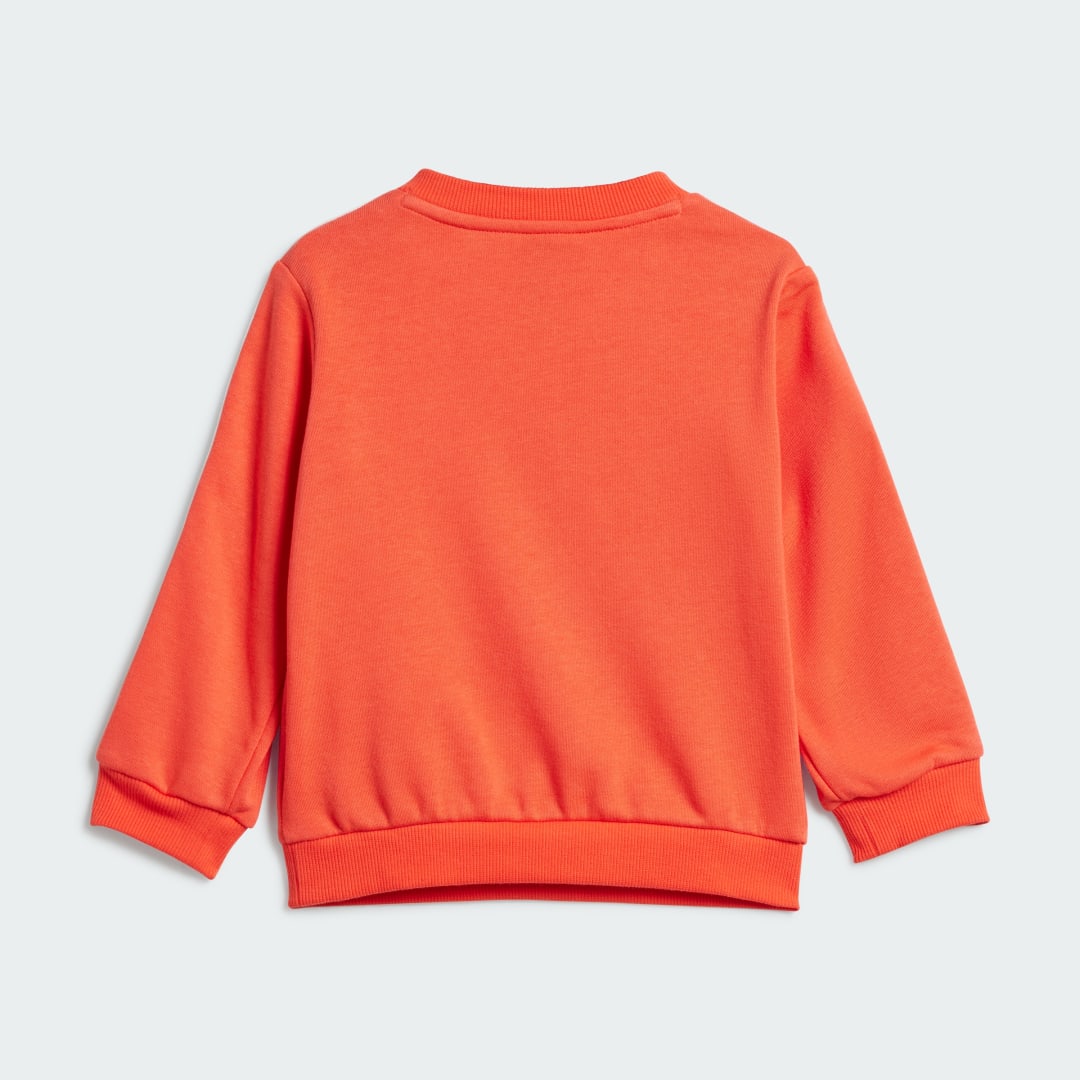 Detalle de Conjunto Essentials 3 bandas (Bebé) de Adidas — sudadera y pantalón naranja