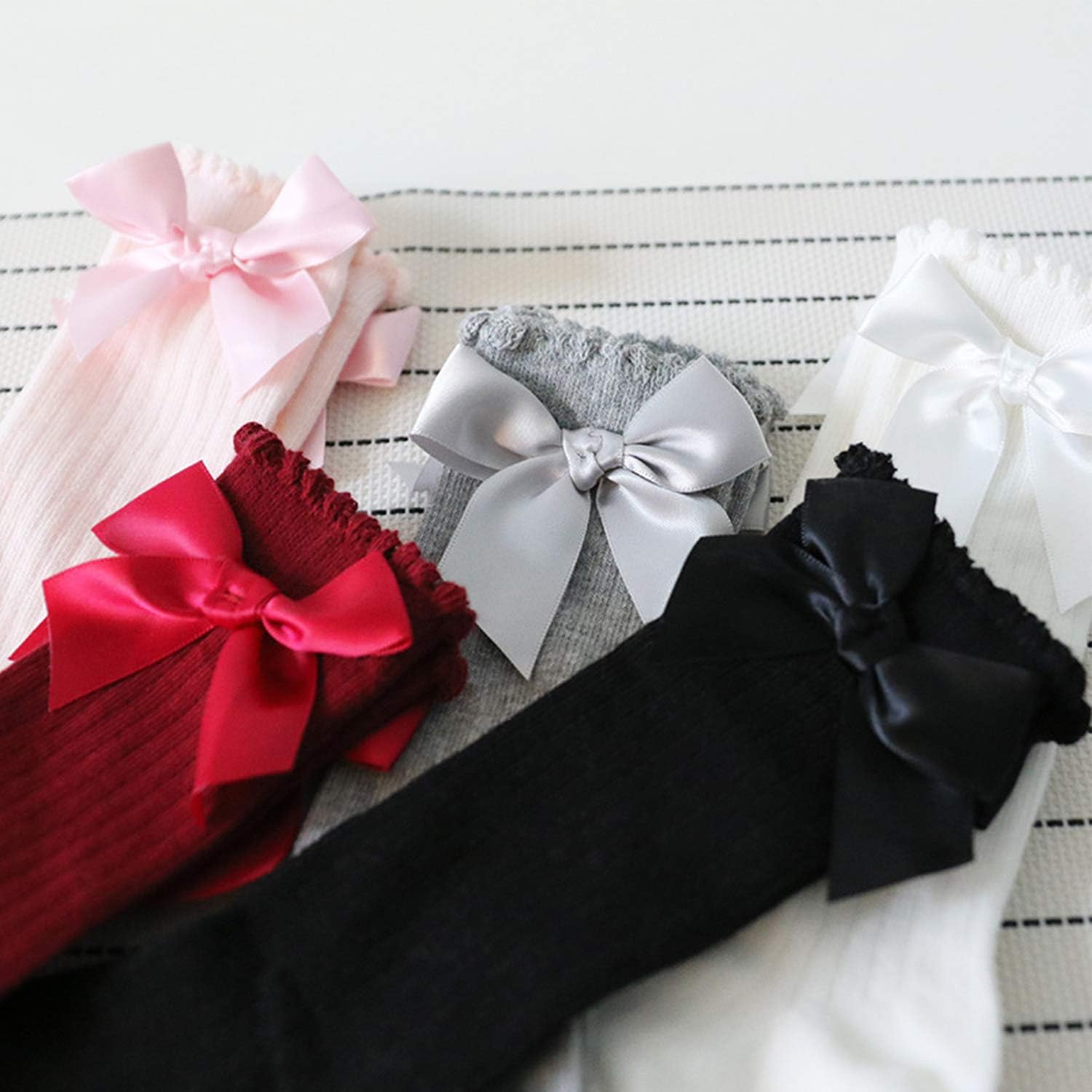 Detalle de DRESHOW baby girl knee-high socks (cotton blend) with bow – toddler dress socks in 5-pair value pack