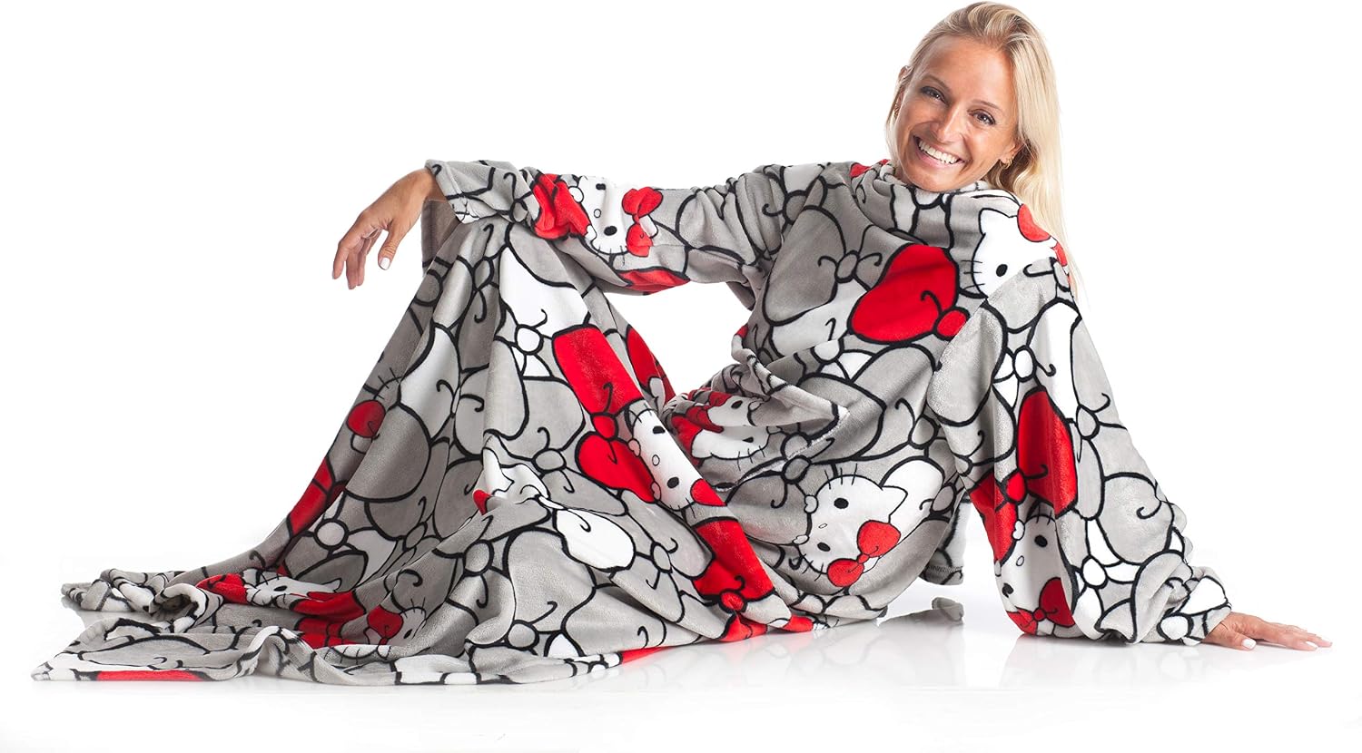 Detalle de Kanguru Deluxe Hello Kitty – koc z rękawami, kieszenią i różową kratką, 140 × 180 cm