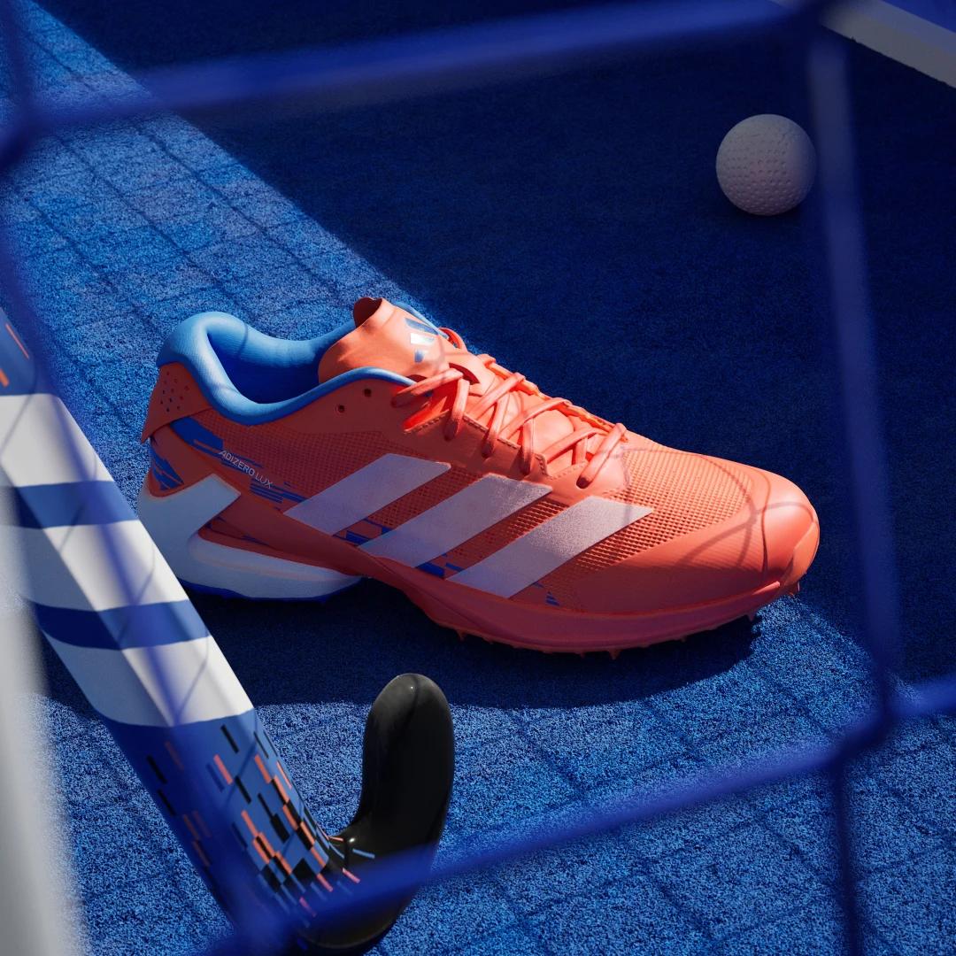 Detalle de Adidas Adizero Lux 3: Bota de hockey sobre hierba en naranja