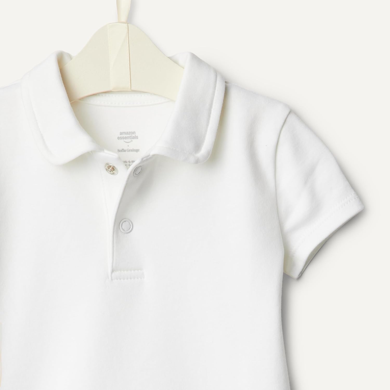 Thumbnail 4 de Amazon Essentials x Sofia Grainge Tutina Polo in Cotone a Maniche Corte, Taglio Bimbo 0-24, Pacco da 2