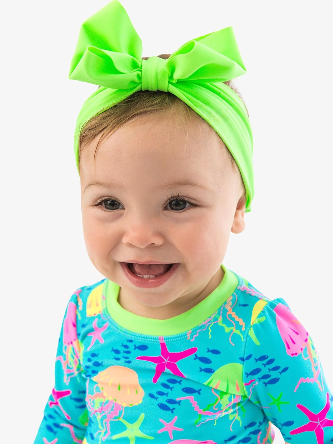 Detalle de RuffleButts Girls' Swim Bow Headband, UPF 50+ Stretch Fabric