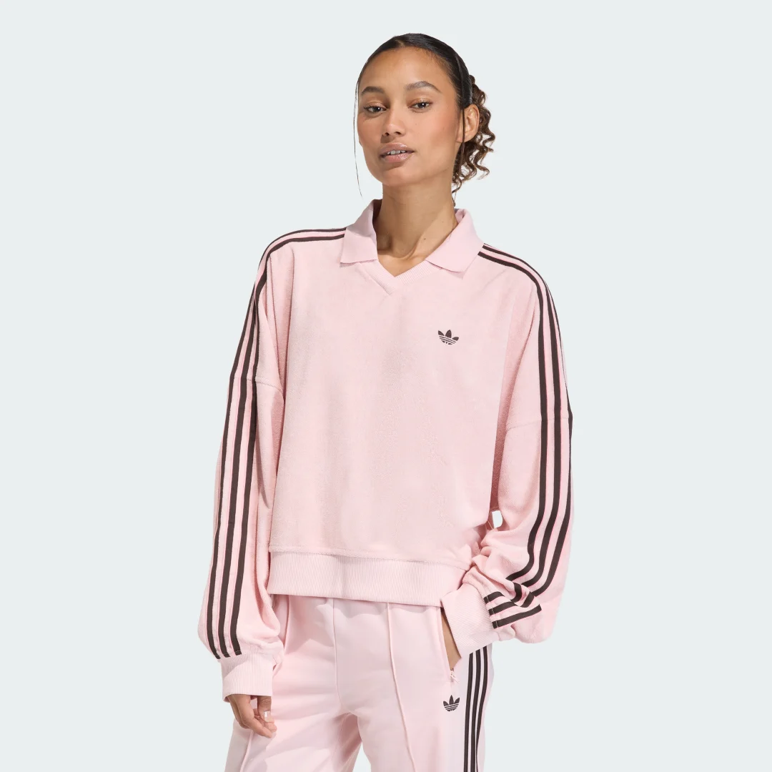Detalle de Polo de rizo y manga larga con cuello de pico de Adidas en rosa