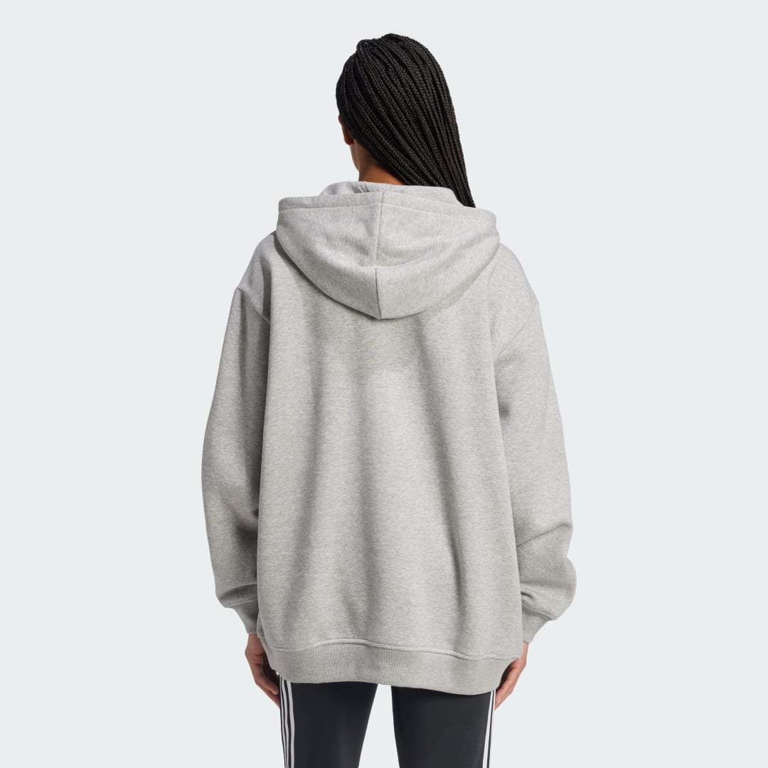 Detalle 2 de Sudadera con capucha Essentials Oversized Fleece de Adidas: comodidad y estilo urbano en gris