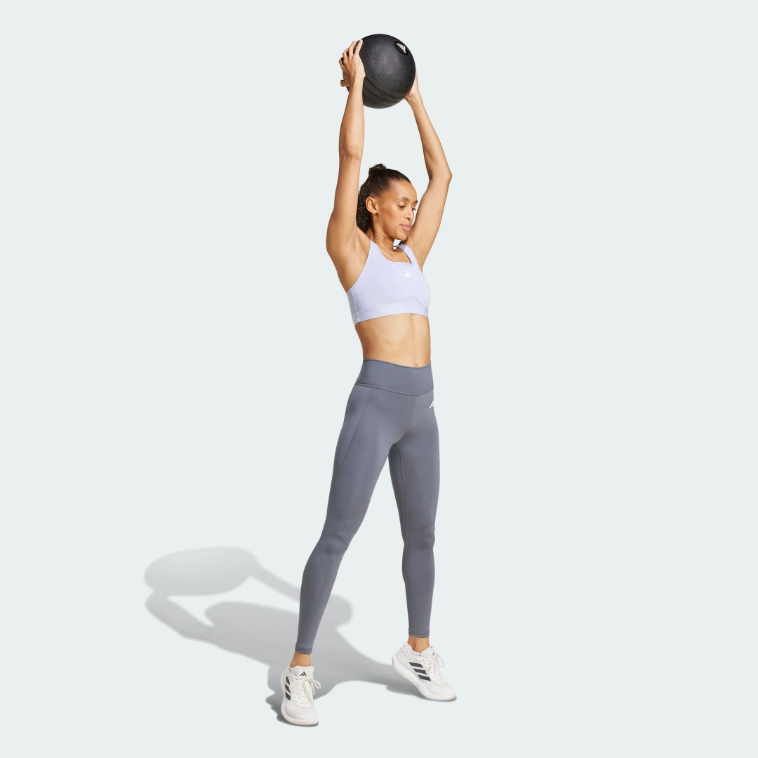Detalle de Mallas largas con bolsillo oculto Optimé Essentials de Adidas – estilo práctico para tus entrenamientos