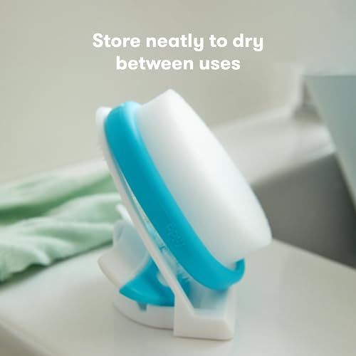 Detalle de Frida Baby The 3-Step Cradle Cap System with DermaFrida The FlakeFixer, Sponge, Brush, Comb & Storage Stand