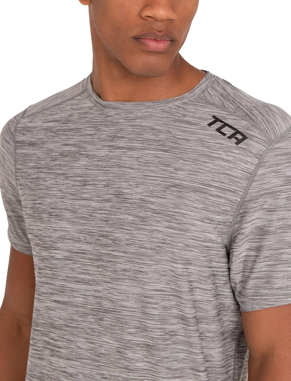 Detalle de TCA T-Shirt de Sport à Manches Courtes pour Homme – Technologie D.R.Y., coupe ajustée, motif Galaxy