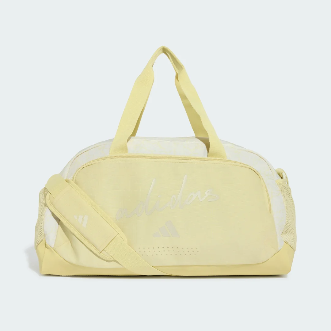 Detalle de Bolso de viaje adidas WOMAN DEFENDER DUFFLE S. Diseño estampado en amarillo