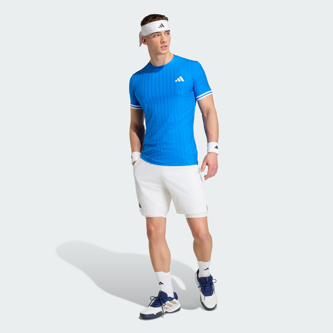 Detalle de Conjunto Adidas Climacool: pantalón corto y mallas de tenis en blanco