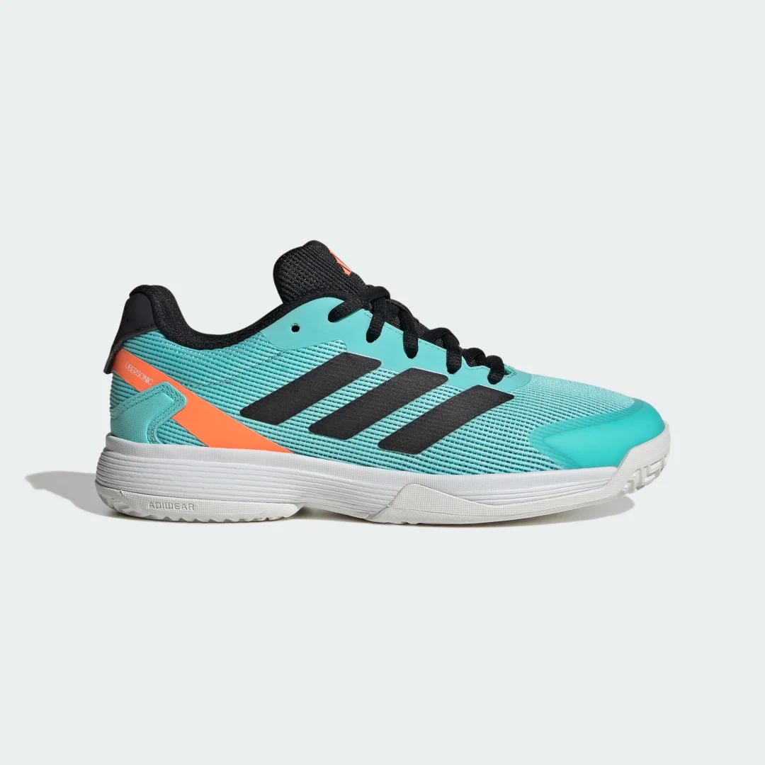 Detalle de Zapatilla Ubersonic Tennis (Niños) de Adidas: comodidad y juego seguro en Turquesa