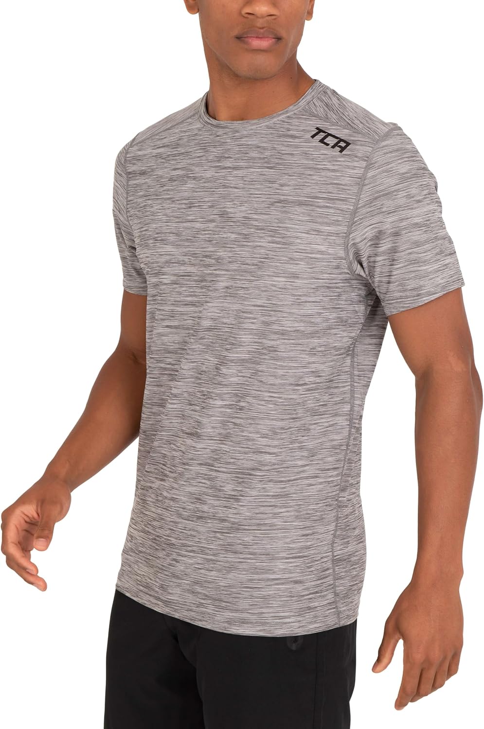 Detalle de TCA T-Shirt de Sport à Manches Courtes pour Homme – Technologie D.R.Y., coupe ajustée, motif Galaxy