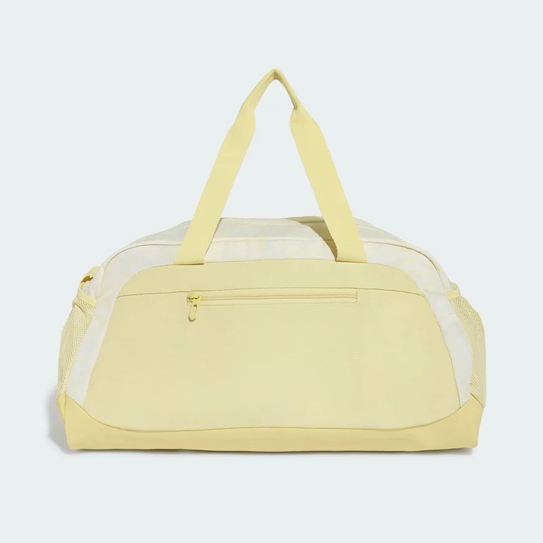Detalle 2 de Bolso de viaje adidas WOMAN DEFENDER DUFFLE S. Diseño estampado en amarillo