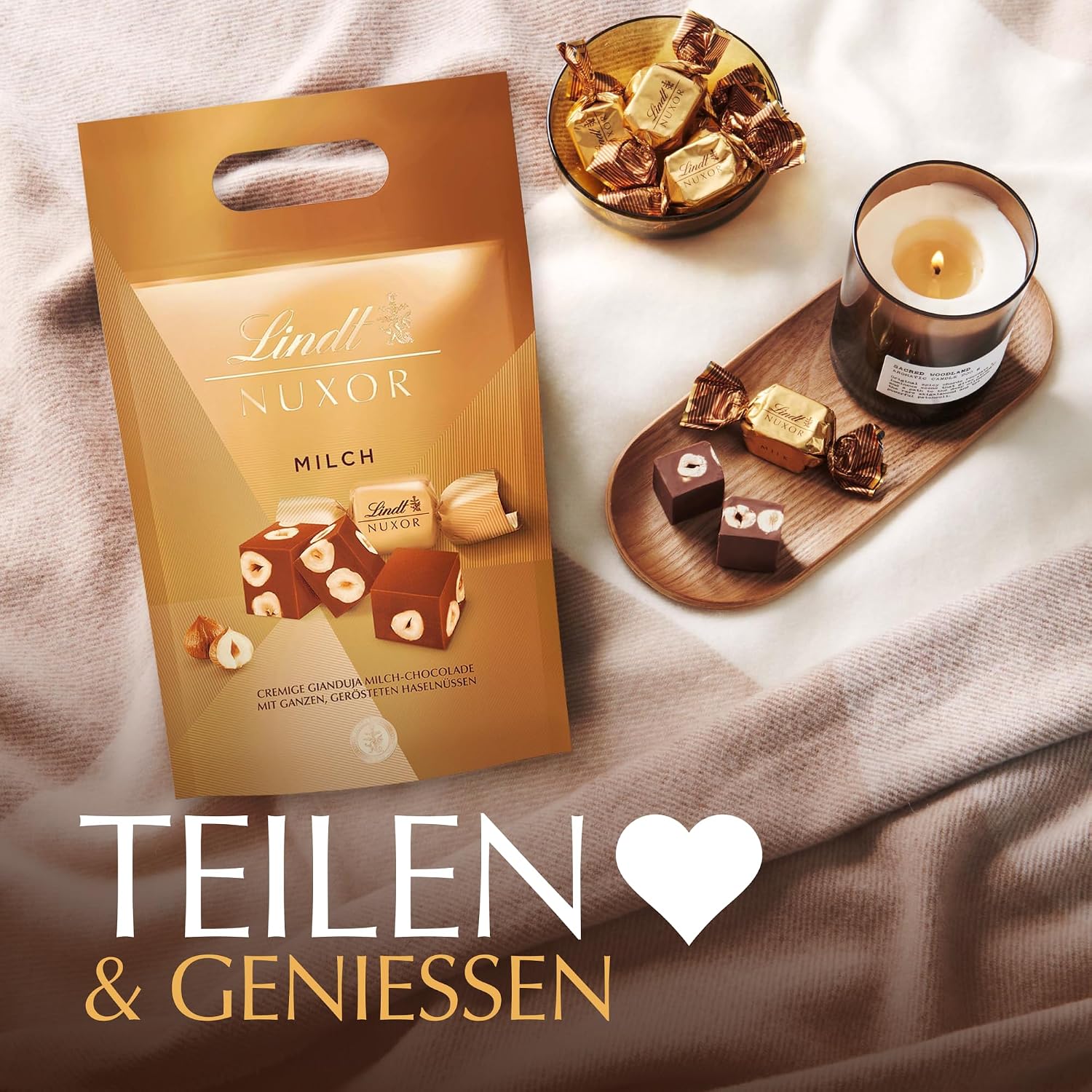 Detalle de Lindt Schokolade | NUXOR Beutel XXL Milch 700 g – Cremige Gianduja-Würfel mit ganzen Haselnüssen