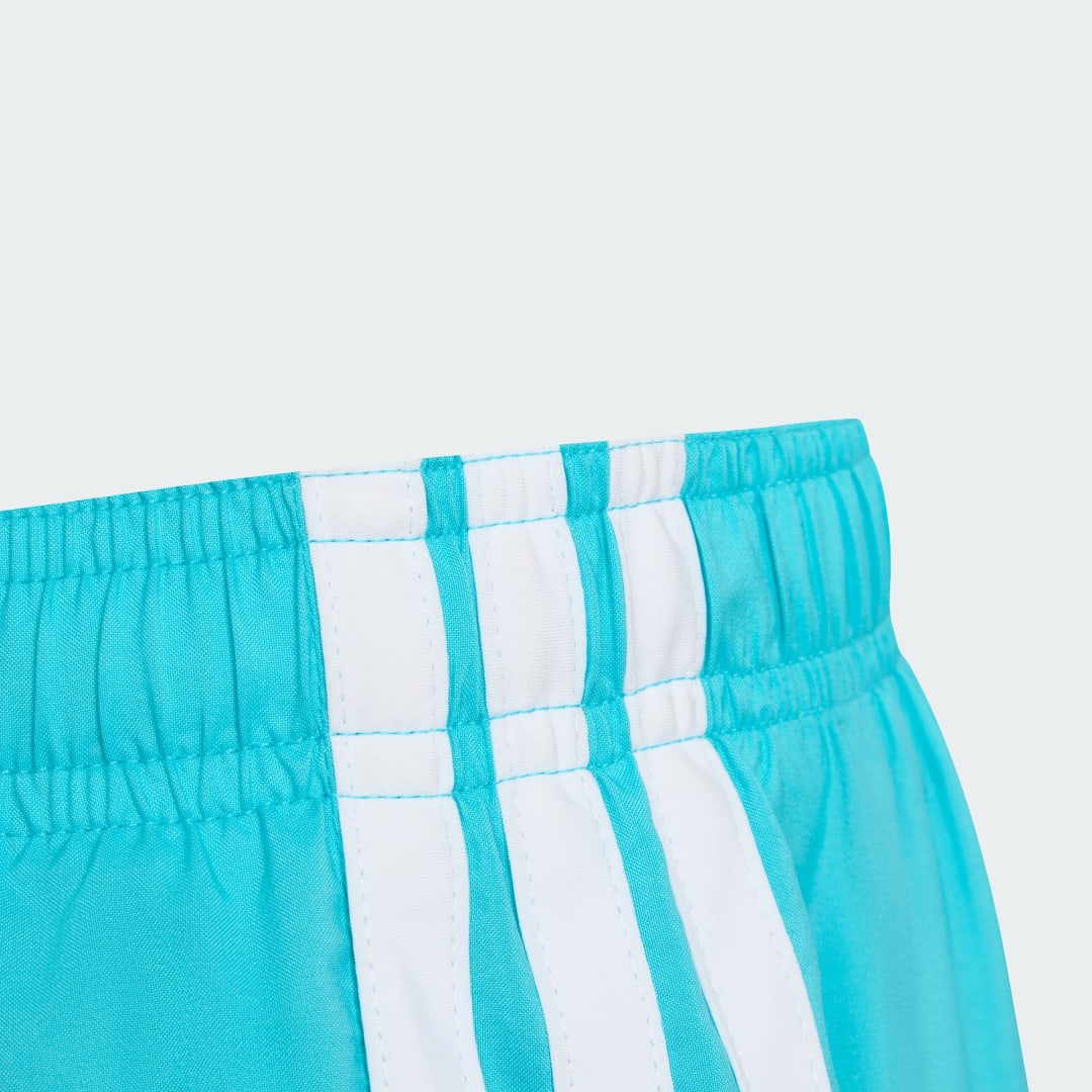 Detalle de Bañador 3 bandas (Niños) de Adidas: turquesa, práctico y con estilo para los más pequeños