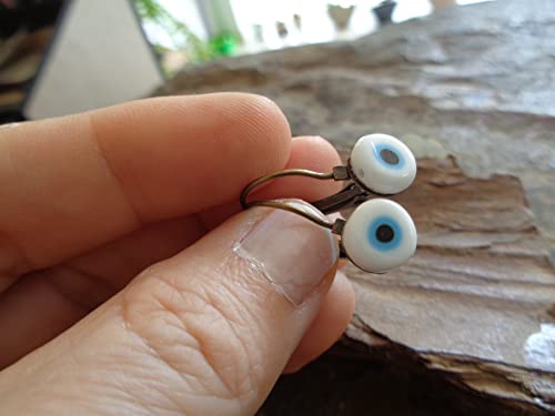Detalle de Orecchini Evil Eye in bronzo con cabochon e perla - Asai Bolivien Ethno Tribal