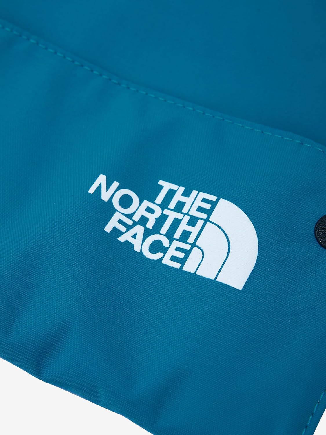 Detalle de THE NORTH FACE NNB22512 コンパクトヤミービブ 防水透湿素材のベビー食事用エプロン
