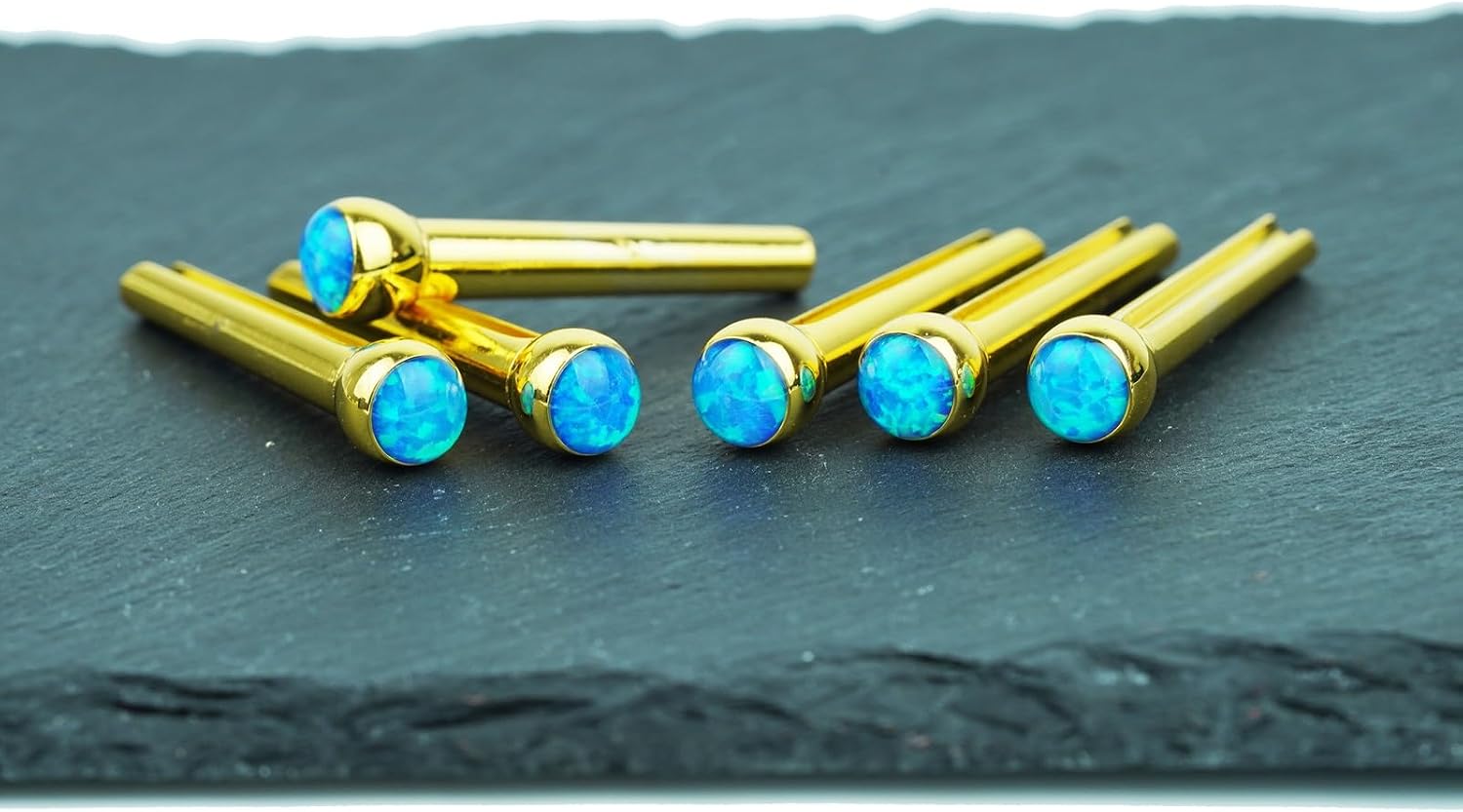 Detalle 2 de Guyker G-bridge-pin-002-GX012 Brass Guitar Bridge Pins, GX-012 Blue Glass, 6-Pack