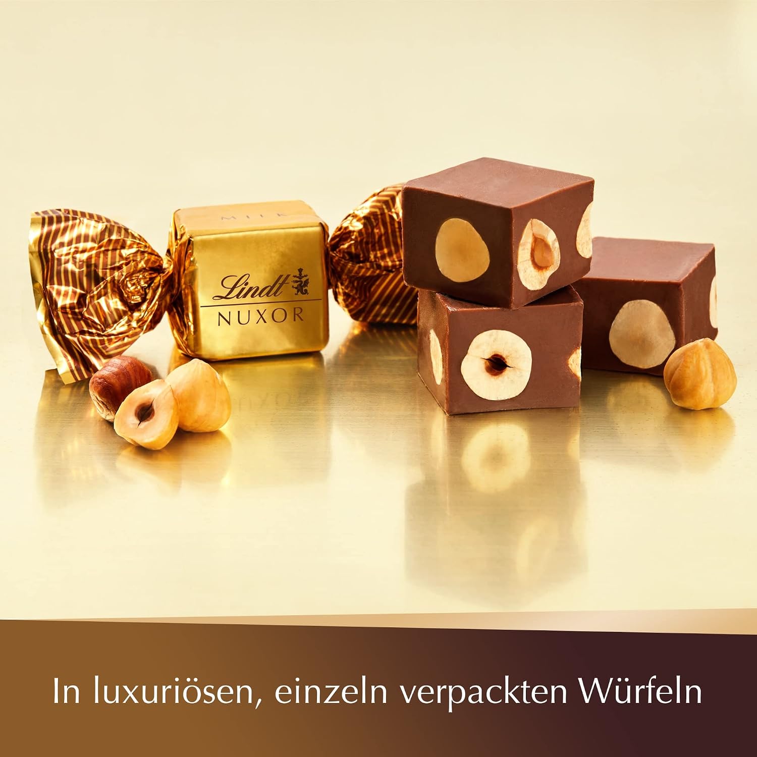 Detalle de Lindt Schokolade | NUXOR Beutel XXL Milch 700 g – Cremige Gianduja-Würfel mit ganzen Haselnüssen