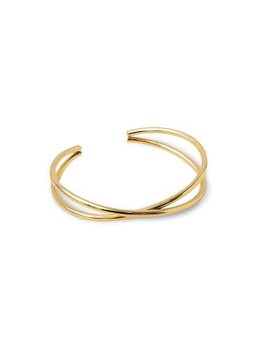 Detalle de SINGULARU - Brazalete Cruzado: Pulsera rígida en acero con baño de oro 18kt, doble hilo cruzado