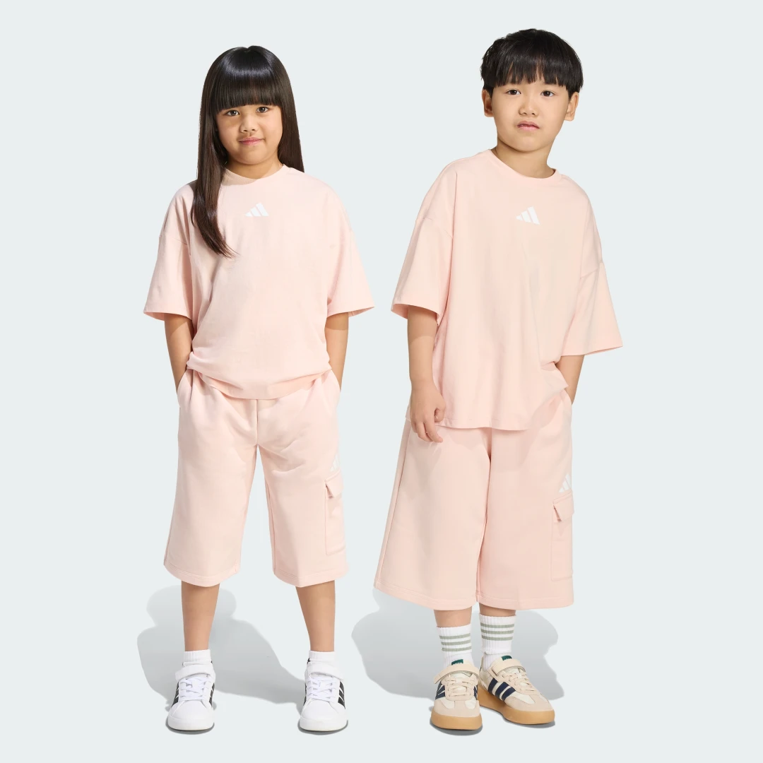 Detalle de Conjunto con camiseta TIRO_NSTER de Adidas — rosa, cómodo y práctico para entrenos