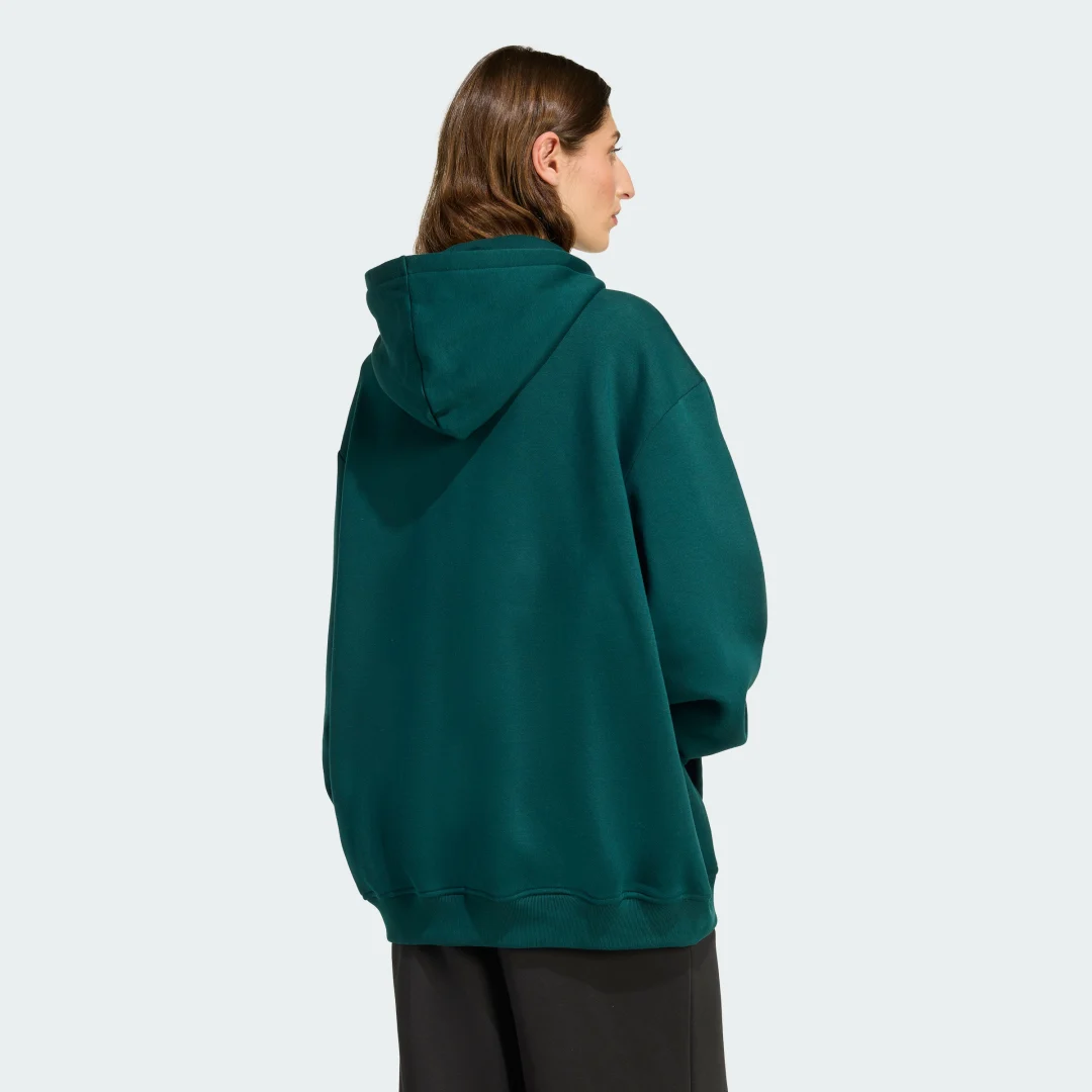Detalle 2 de Sudadera con capucha Essentials Oversized Fleece de Adidas (Verde): comodidad casual para tu día a día