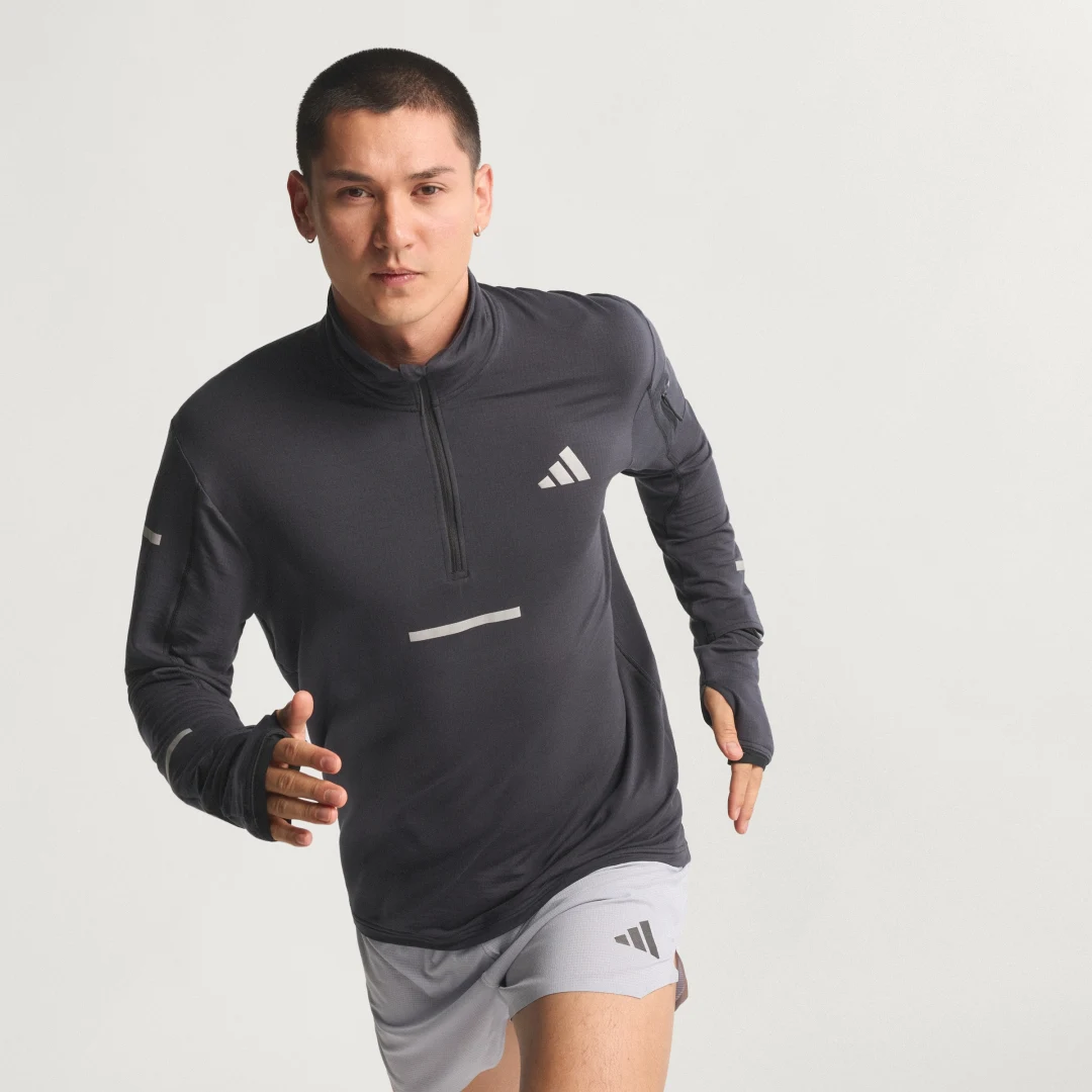 Detalle de Camiseta de running Adi365 CLIMAWARM+ con cremallera hasta el pecho de Adidas
