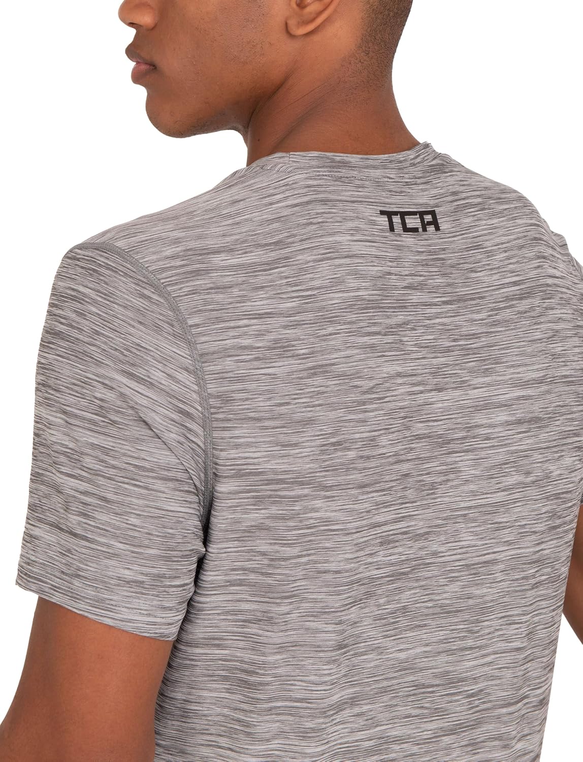 Detalle de TCA T-Shirt de Sport à Manches Courtes pour Homme – Technologie D.R.Y., coupe ajustée, motif Galaxy