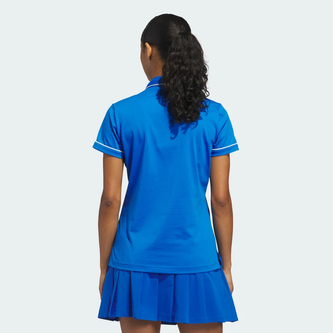 Detalle de Polo Originals Solid de Adidas en azul — estilo clásico para el día a día