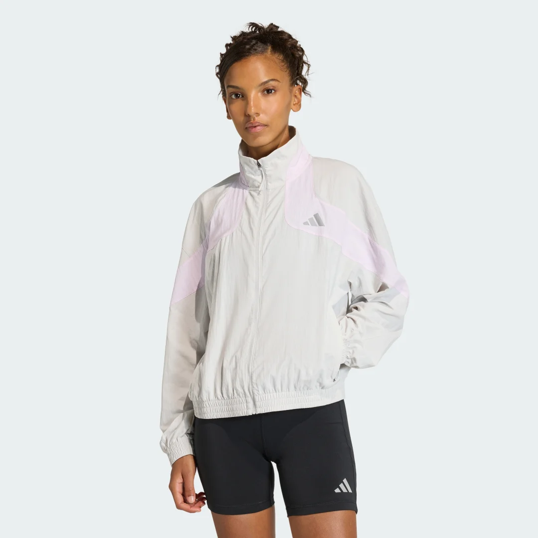 Detalle de Chaqueta adi365 Cheering de Adidas: estilo y comodidad en gris