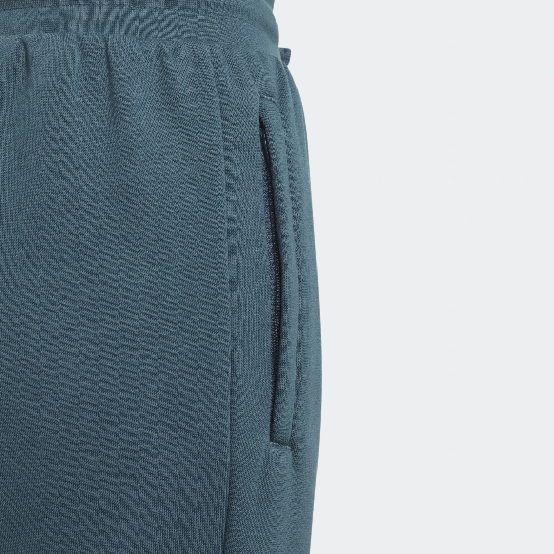 Detalle de Pantalón Adicolor de Adidas en Turquesa