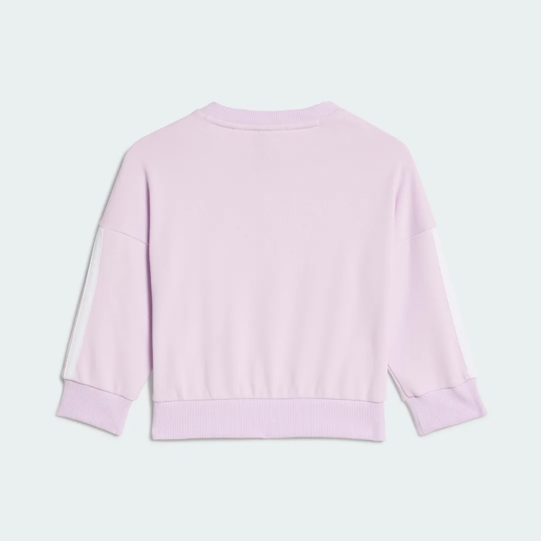 Detalle de Conjunto Essentials (Bebé) de Adidas: sudadera y pantalón en violeta