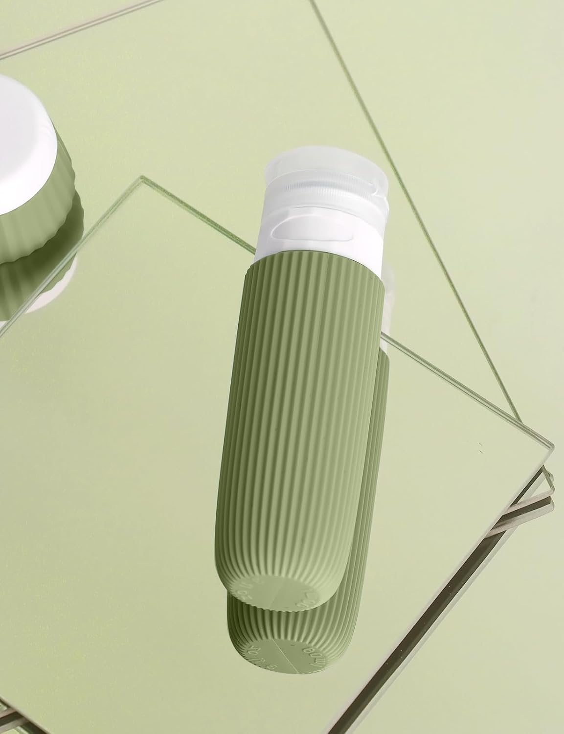 Detalle de Yiorxu Reiseflaschen zum Befüllen (9-teilig) mit 90 ml + 30 ml Silikon-Behältern und TSA-Handgepäck-Set