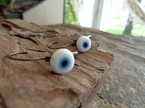 Detalle de Orecchini Evil Eye in bronzo con cabochon e perla - Asai Bolivien Ethno Tribal