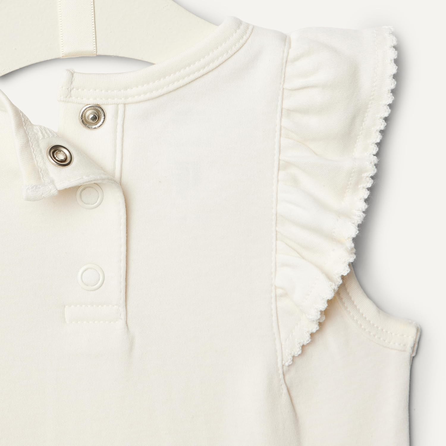 Detalle de Amazon Essentials x Sofia Grainge Body in cotone con volant e ricami - Pack da 2 per bambine e ragazze