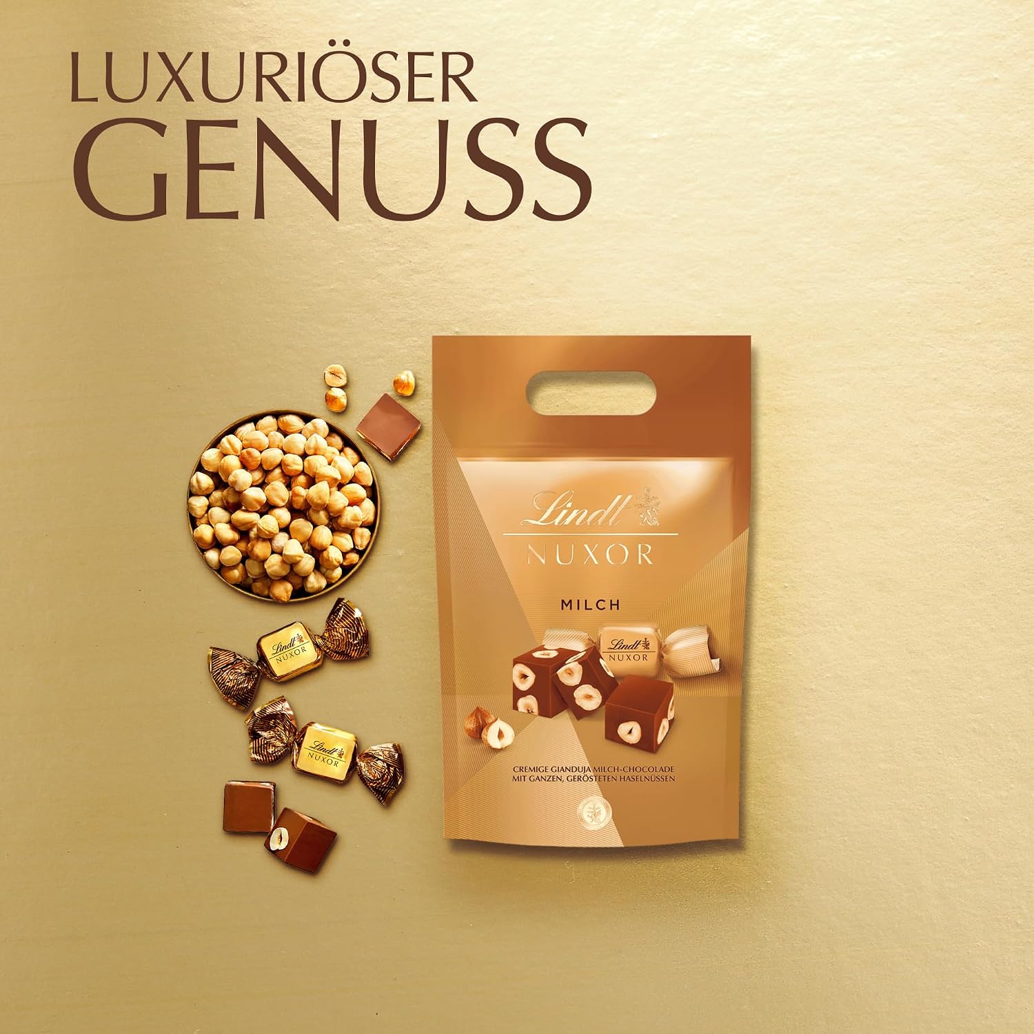 Detalle de Lindt Schokolade | NUXOR Beutel XXL Milch 700 g – Cremige Gianduja-Würfel mit ganzen Haselnüssen