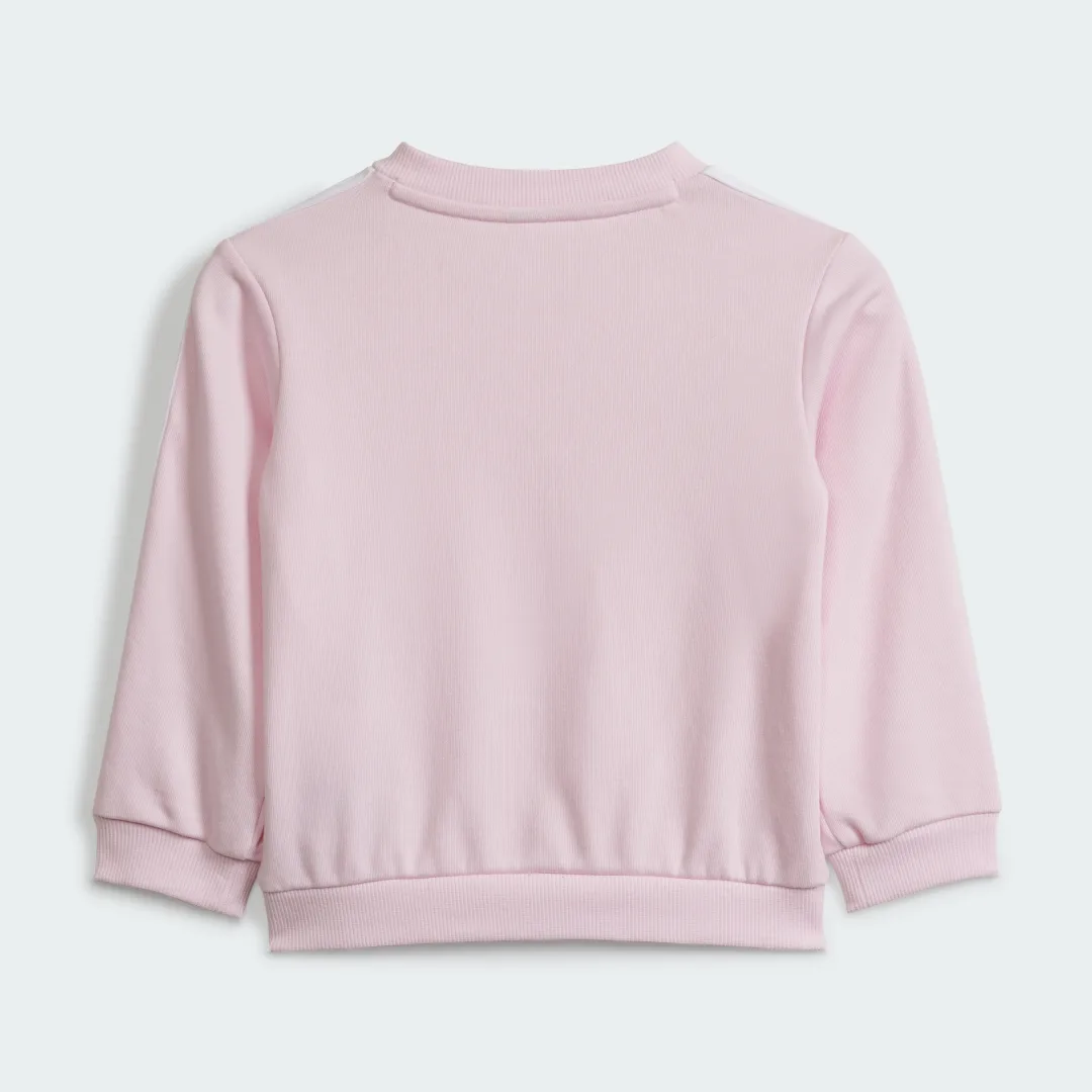 Detalle de Conjunto Essentials 3 bandas (Bebé) de Adidas – sudadera y pantalón en color Rosa