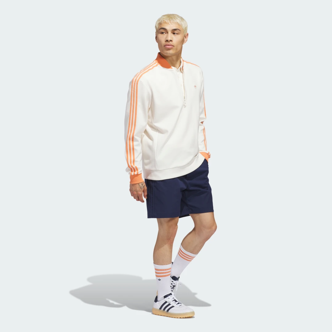 Detalle de Sudadera Originals 1/4 Zip 3 bandas de Adidas: comodín diario con toque clásico