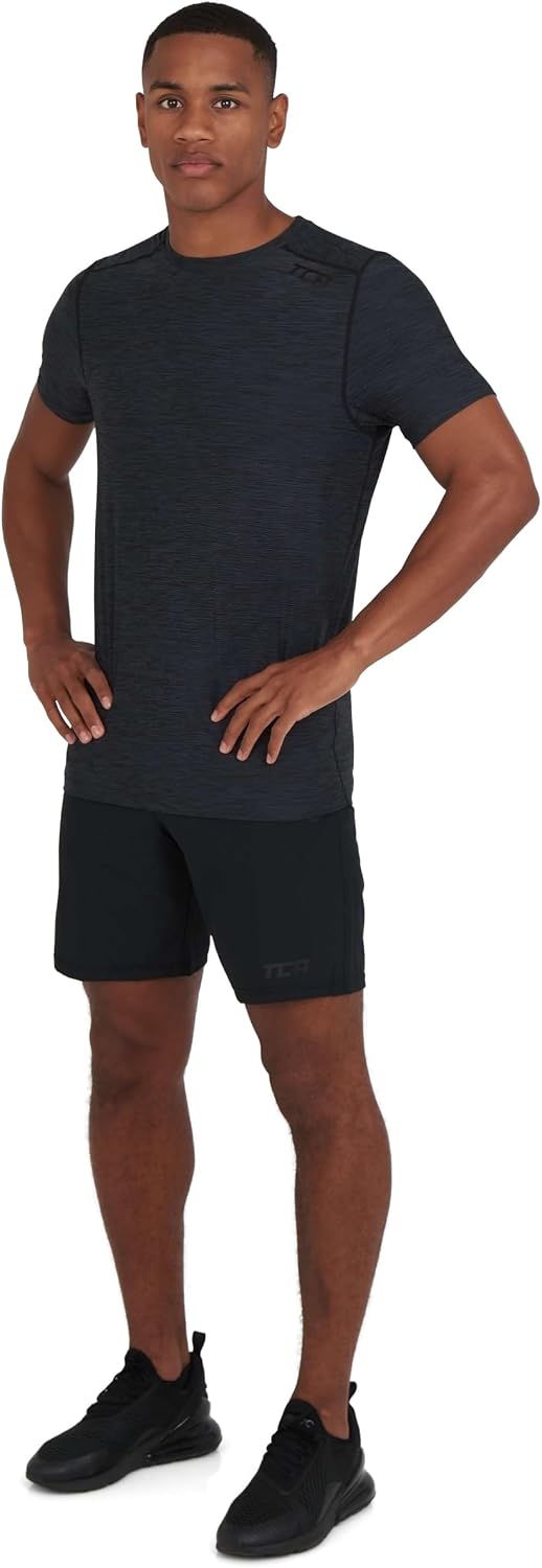 Detalle de TCA Galaxy Maglietta Palestra Uomo - Maglia Running a Maniche Corte, stile spacedye e tecnologia D.R.Y. per allenamenti comodi