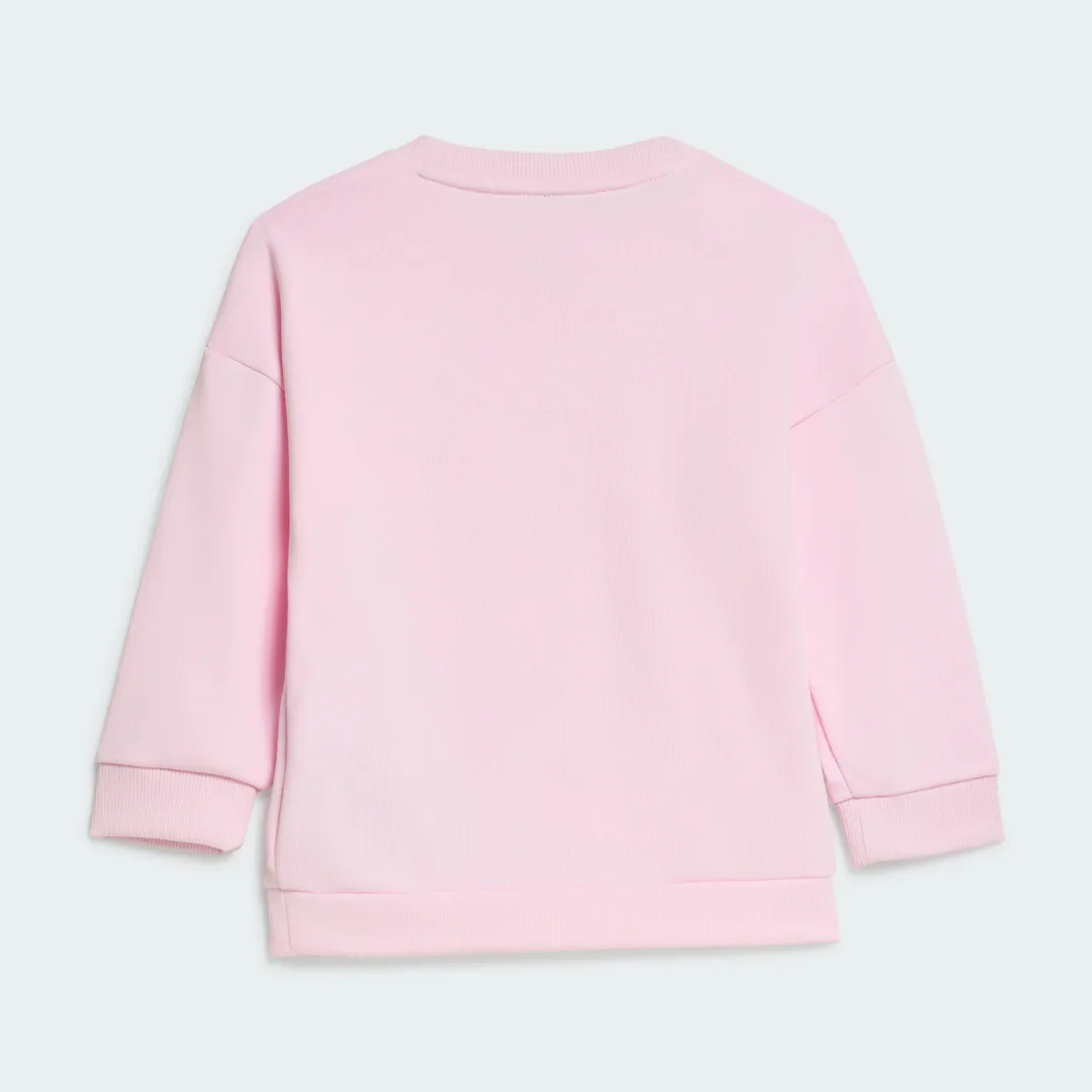 Detalle de Conjunto Adidas con mallas y estampado animal en rosa