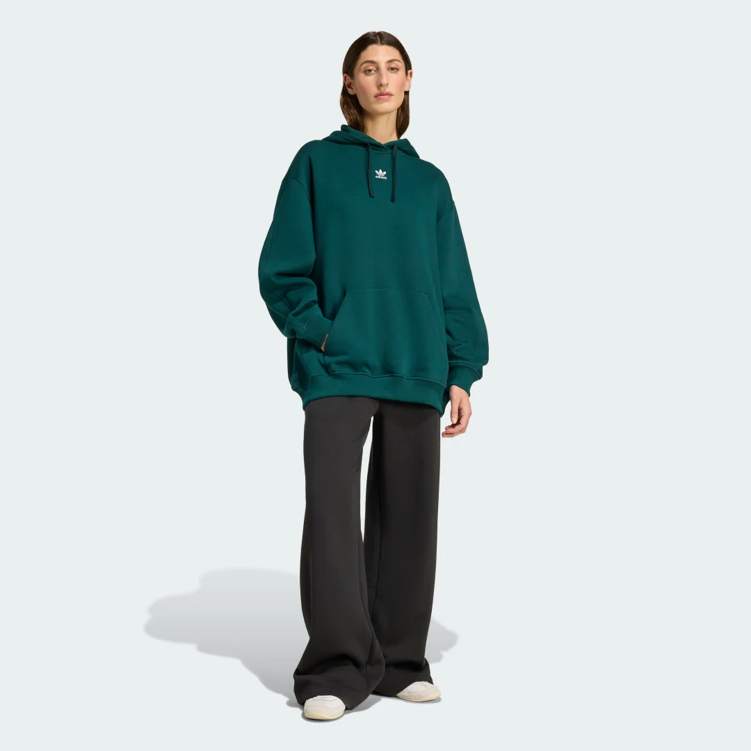 Detalle de Sudadera con capucha Essentials Oversized Fleece de Adidas (Verde): comodidad casual para tu día a día