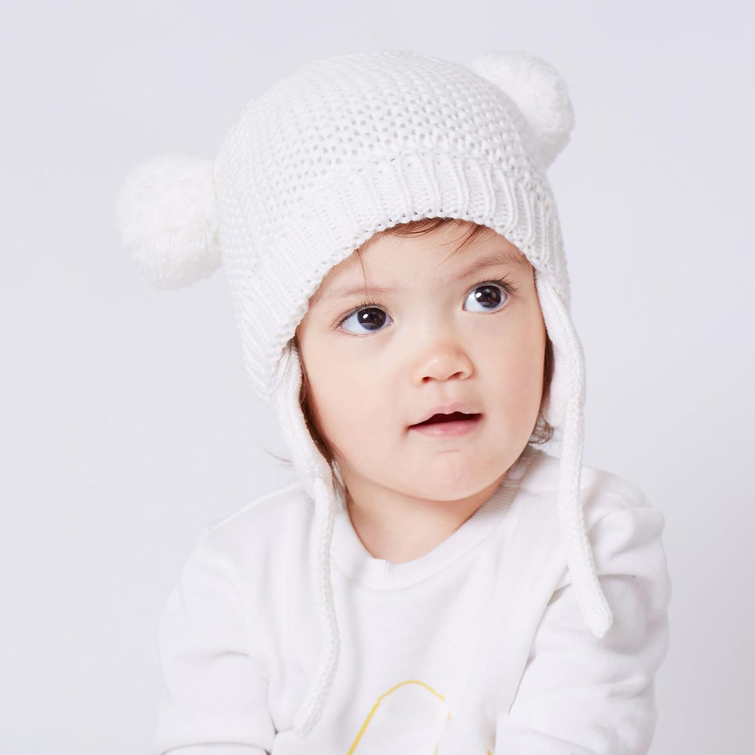 Detalle de Exemaba Baby Warm Hat with Earflaps, Fleece Lining and Chin Strap – Pom-pom Winter Beanie for Toddlers