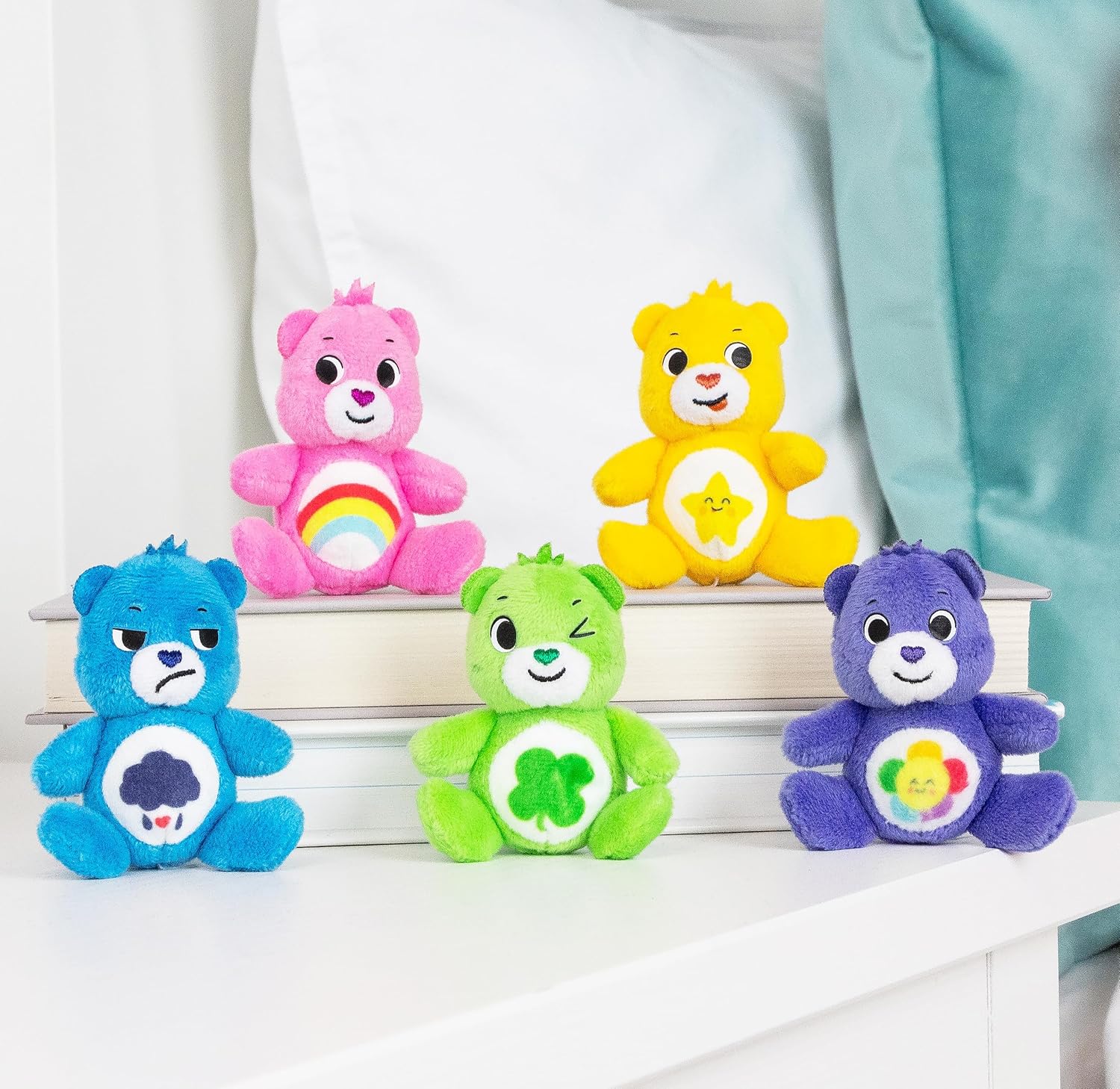 Detalle 2 de Care Bears Confezione di 5 Micro Peluche: Allegria, Sorridente, Buona Fortuna, Burbero e Armonia