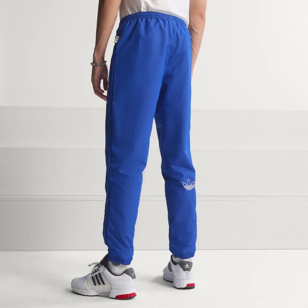Thumbnail 1 de Pantalón Graphic Woven Track Pants de Adidas — azul, cómodo y con estilo deportivo