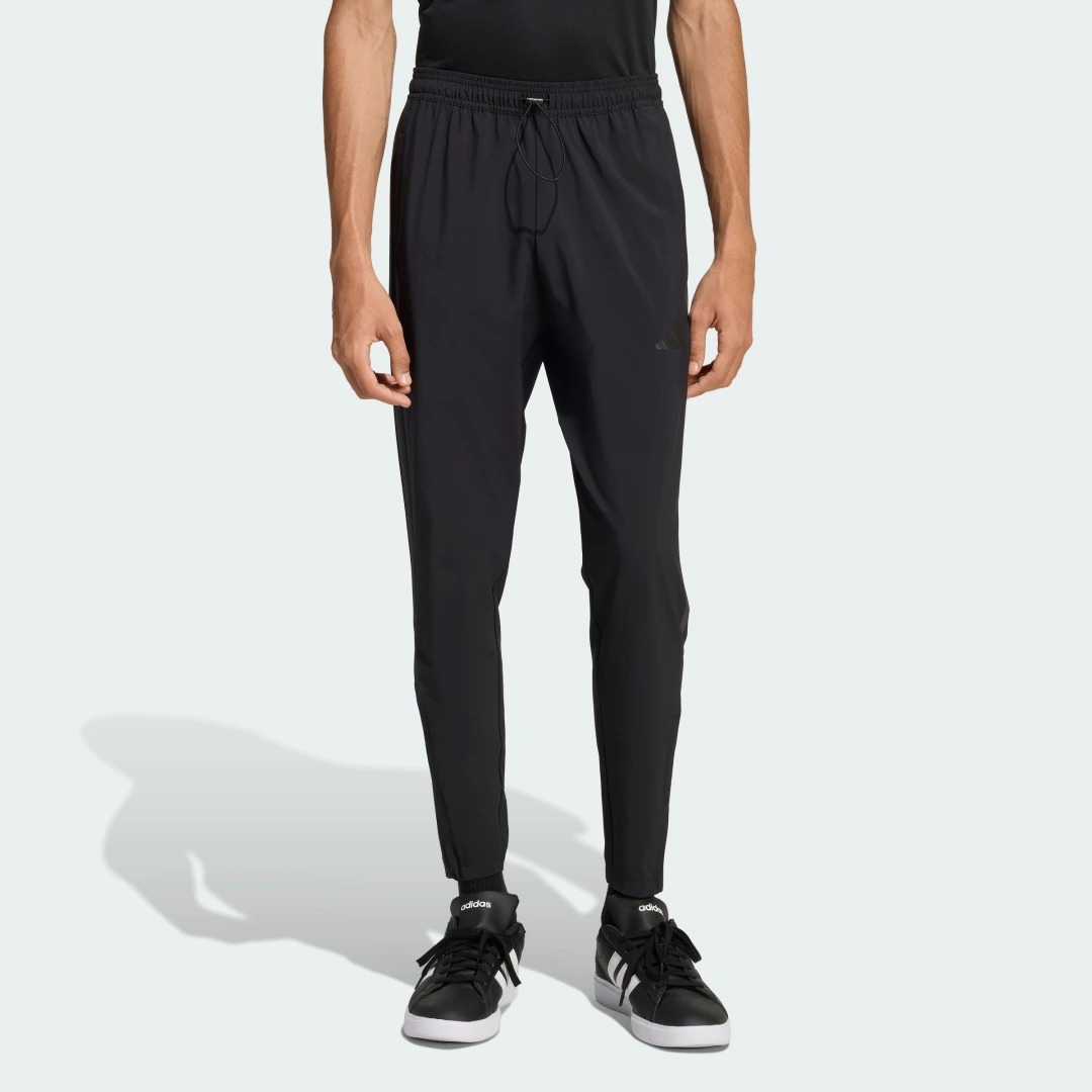 Detalle de PANTALÓN HOUSE OF TIRO de Adidas – versatilidad y estilo en Negro