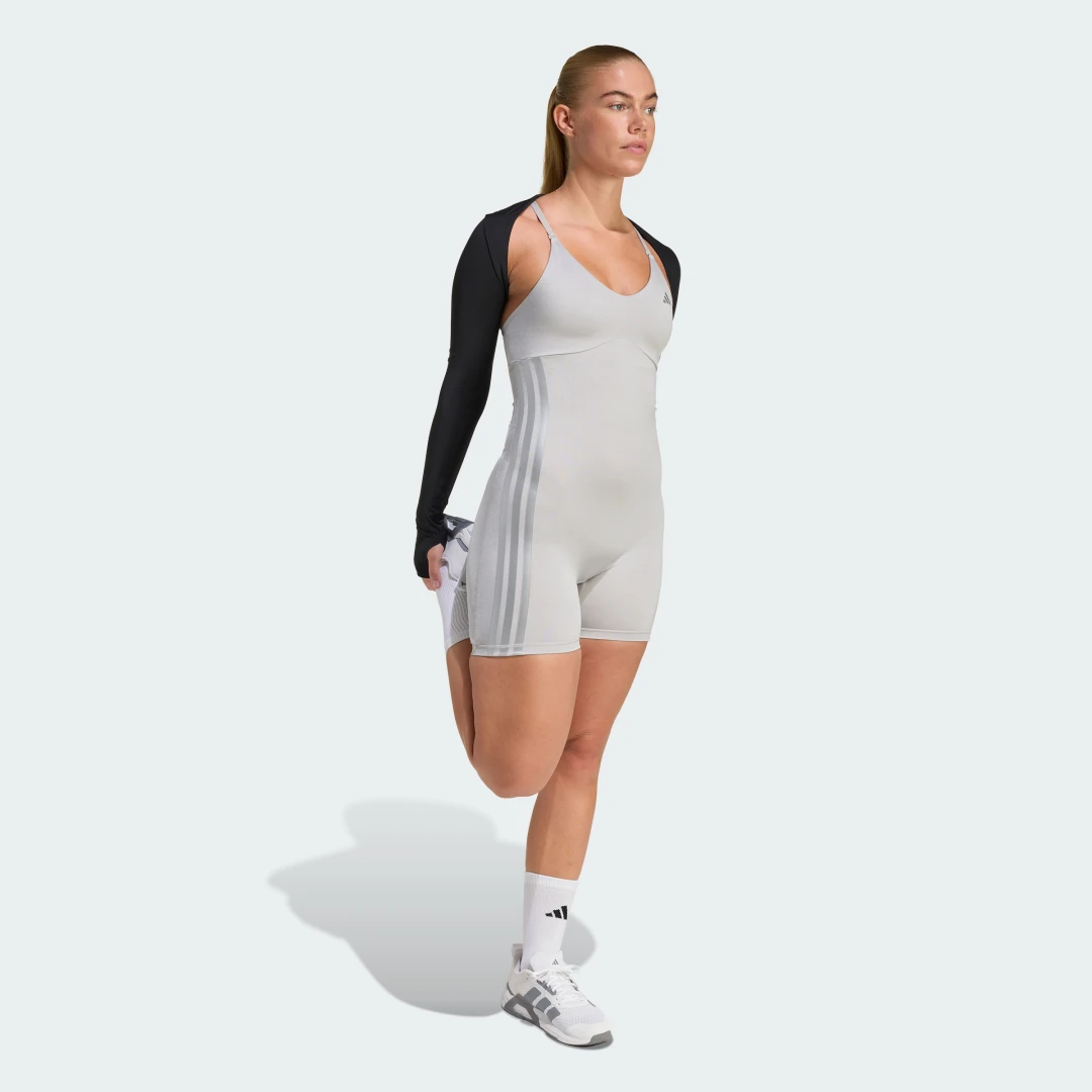 Detalle de Adidas PrimeLift Essentials, bolero de entrenamiento negro con efecto moldeador