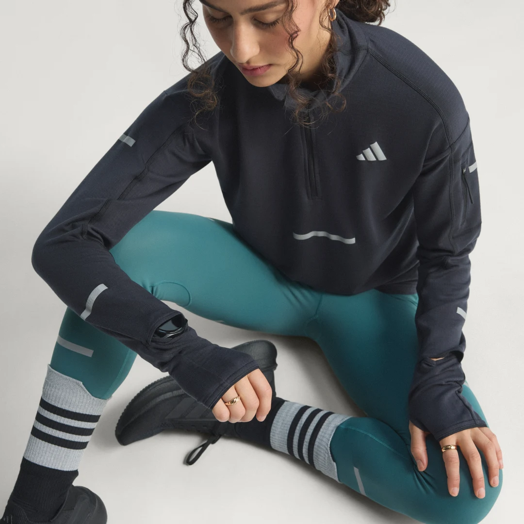 Detalle de Camiseta de running Adi365 CLIMAWARM+ con cremallera al pecho de Adidas (Negro)