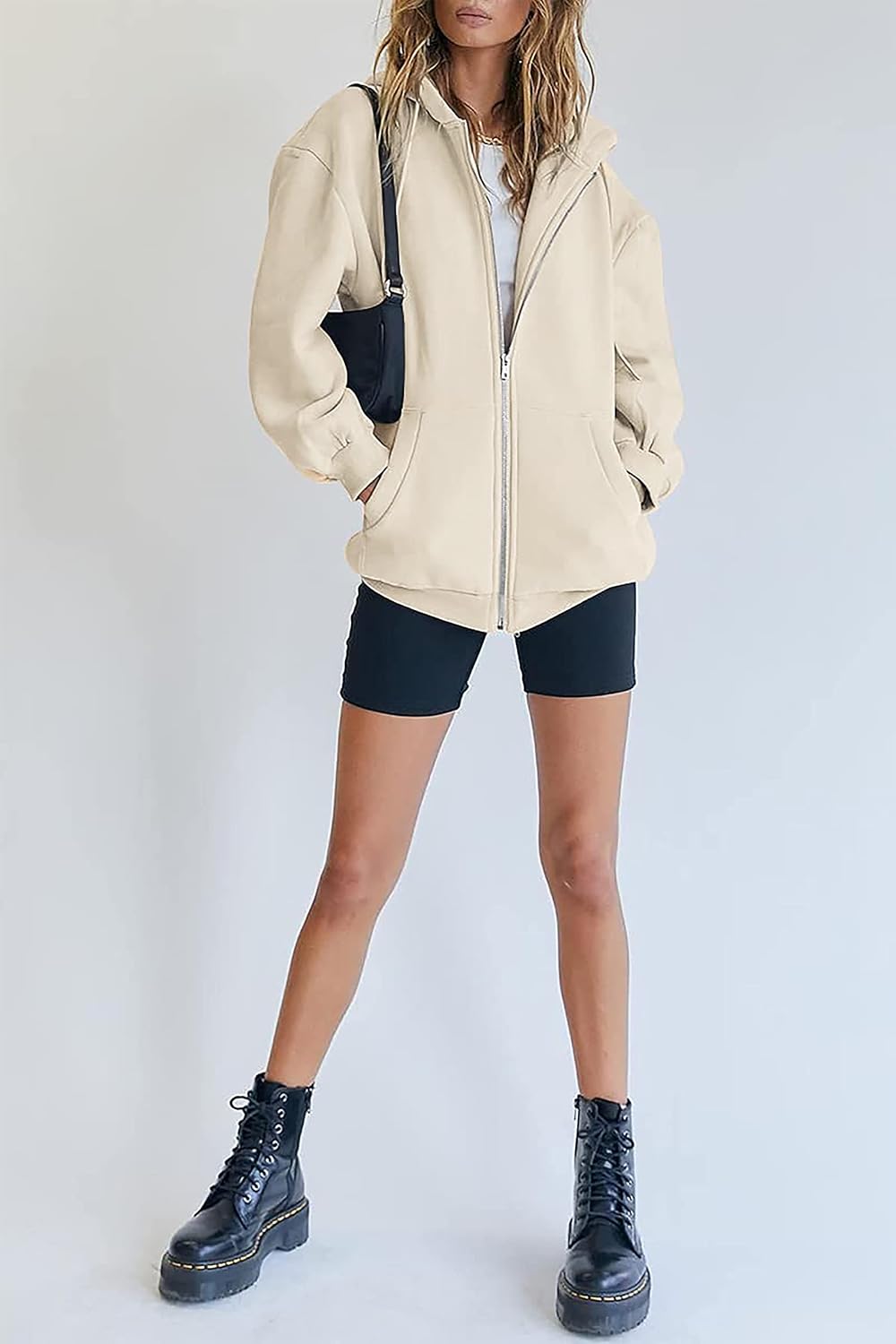 Detalle 2 de Timuspo damestrui met capuchon, lang oversized model met ritssluiting