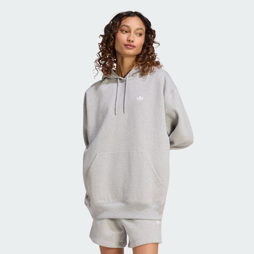 Detalle de SUDADERA CON CAPUCHA DE FELPA Y CORTE HOLGADO ESSENTIALS de Adidas – comodidad casual en gris