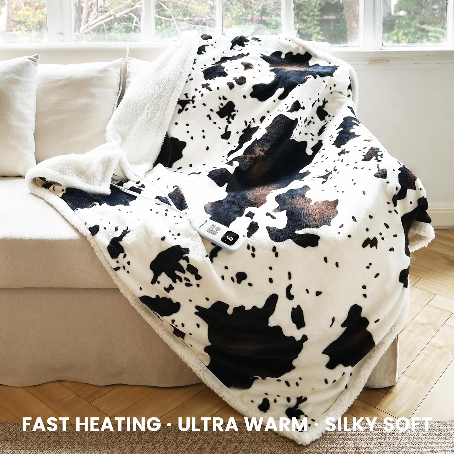Detalle 2 de blunique Cow Print Heated Throw with 10 Heat Levels ⚡
